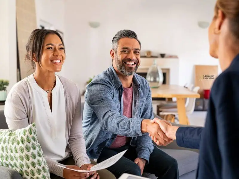 couple meeting with Kid Breukelen Realty Group interested discussion our array of services and property managment fees